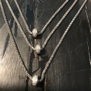 Triple strand woven silver chain necklace